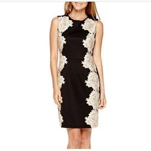 Black dress with large lace flowers on sides